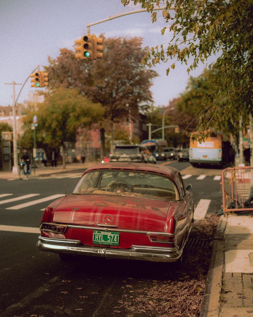 A red car parked on the side of the road